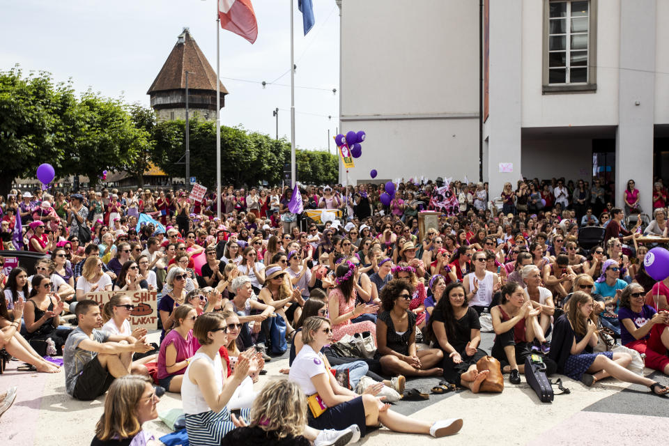 Women protest during a nationwide women's strike in Lucerne, Switzerland, June 14, 2019. There is list of several reasons motivating people to take part in the strike. These range from unequal wages to pressures on part-time employees, the burden of household work and sexual violence. (Alexandra Wey/Keystone via AP)