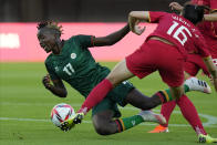 Zambia's Racheal Kundananji (17) collides with China's Wang Xiaoxue (16) during a women's soccer match at the 2020 Summer Olympics, Saturday, July 24, 2021, in Miyagi, Japan. (AP Photo/Andre Penner)