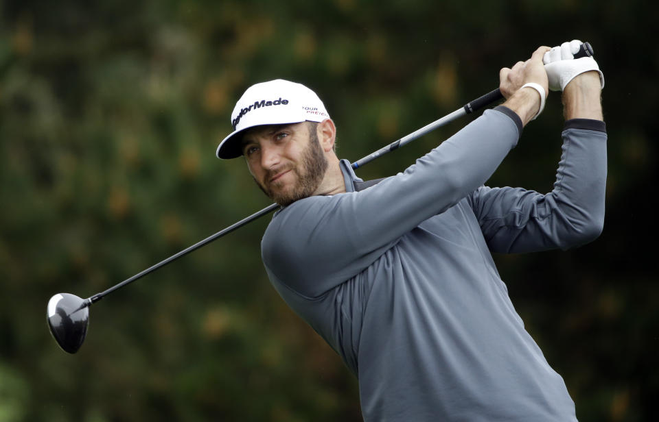 Dustin Johnson hits off the second tee on Sunday, Feb. 9, 2014, during the final round of the AT&T Pebble Beach Pro-Am golf tournament in Pebble Beach, Calif. (AP Photo/Ben Margot)