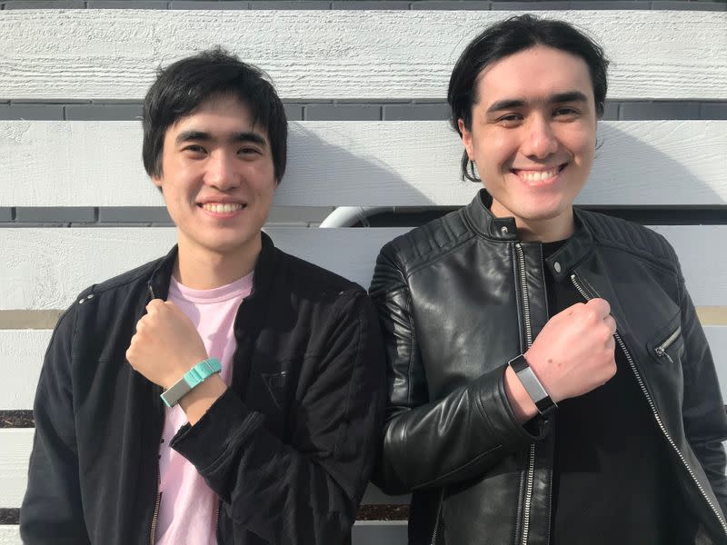 Entrepreneurs Matthew Toles and Joseph Toles, co-founders of the company Slightly Robot, show smartbands, the Immutouch in Seattle