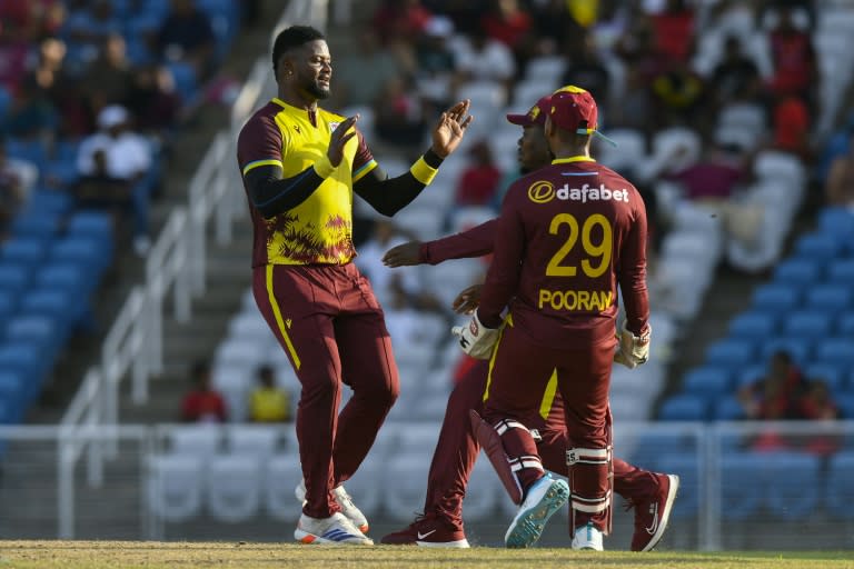 Romario Shepherd of West Indies celebrates the dismissal of Reeza Hendricks of South Africa during the 2nd T20I match at Brian Lara Cricket Academy on Sunday (Randy Brooks)