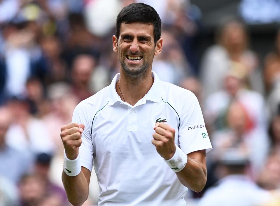 Serbia's Novak Djokovic celebrates winning against Italy's Matteo Berrettini during their men's singles final match on the thirteenth day of the 2021 Wimbledon Championships at The All England Tennis Club in Wimbledon, southwest London, on July 11, 2021.