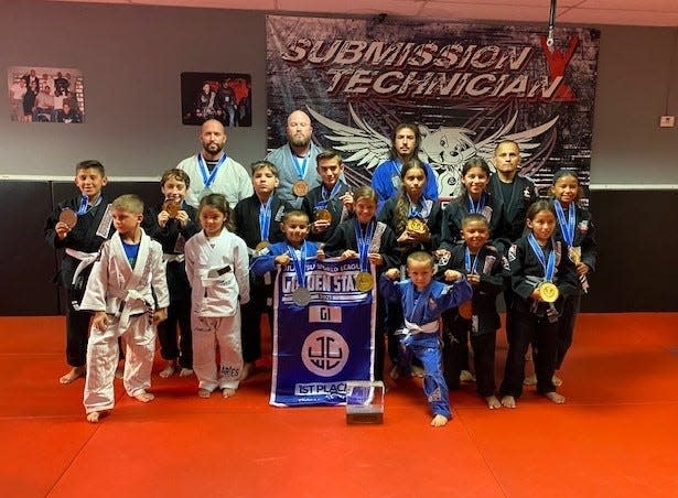 The Brazilian Jiu Jitsu youth team Speedy BJJ, of Tulare, placed first in the Golden State Cup on Aug. 14, 2021 in Stockton. The team includes, top row, left to right: Dustan Wheeler (2nd), Kyle Rening (3rd), Adam Martinez (2nd), Jesus Gonzalez (coach); middle row, left to right: Raul Meraz III (3rd), Roman Solez (1st), Jared Torres (1st), Dylan Costa (1st), Jasmin Gonzalez(1st), Marisa Gonzalez (3rd), Rio Rening (1st); bottom row, left to right: Dustan Wheeler, Emma Boss (1st), Jesus Gonzalez (2nd), Hayden Ormonde (1st), Hunter Ormonde (4th), Bishop Rening (3rd), Marisela Gonzalez (1st). Not Pictured: Mason Ortiz (4th).