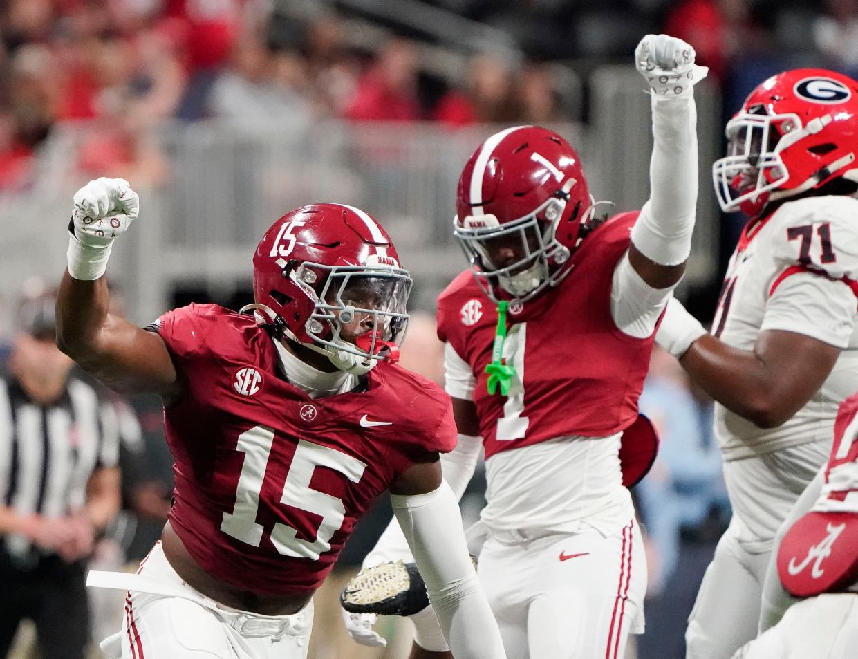 Dec 2, 2023; Atlanta, GA, USA; Alabama Crimson Tide linebacker Dallas Turner (15) and Alabama Crimson Tide defensive back Kool-Aid McKinstry (1) celebrate a stop on third down to force a Georgi field goal attempt at Mercedes-Benz Stadium. Mandatory Credit: Gary Cosby Jr.-USA TODAY Sports