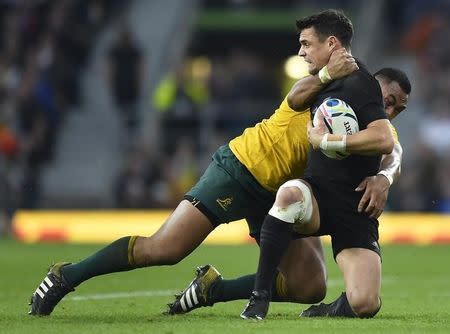 Sekope Kepu of Australia (L) makes a high tackle on Dan Carter of New Zealand during their Rugby World Cup final match at Twickenham in London, Britain October 31, 2015. REUTERS/Toby Melville