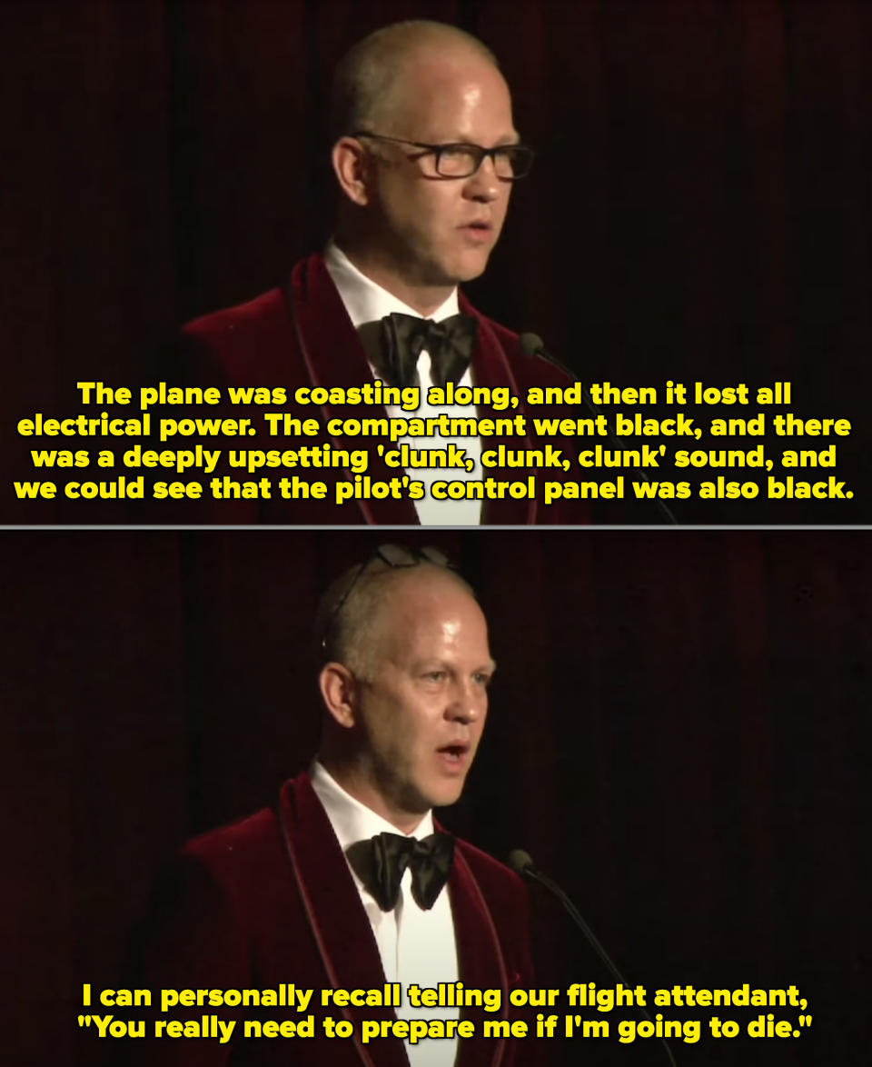 Ryan Murphy in a red-suede suit on stage