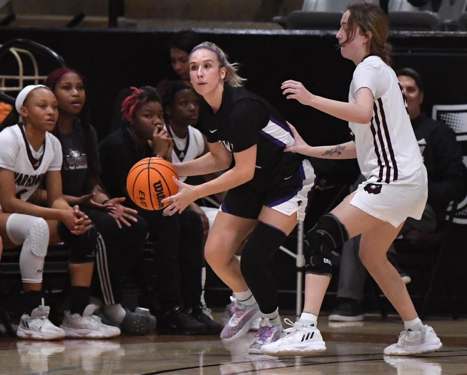 HSU's Paris Kiser looks for a teammate to pass to during the Cowgirls' crosstown game against McMurry.