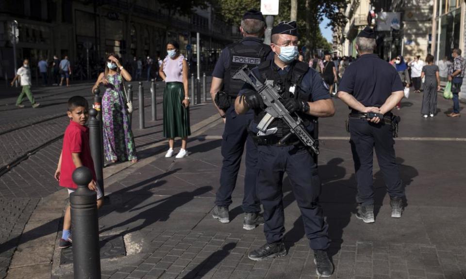 Police officers on patrol in Marseille, where face masks are compulsory in public spaces.