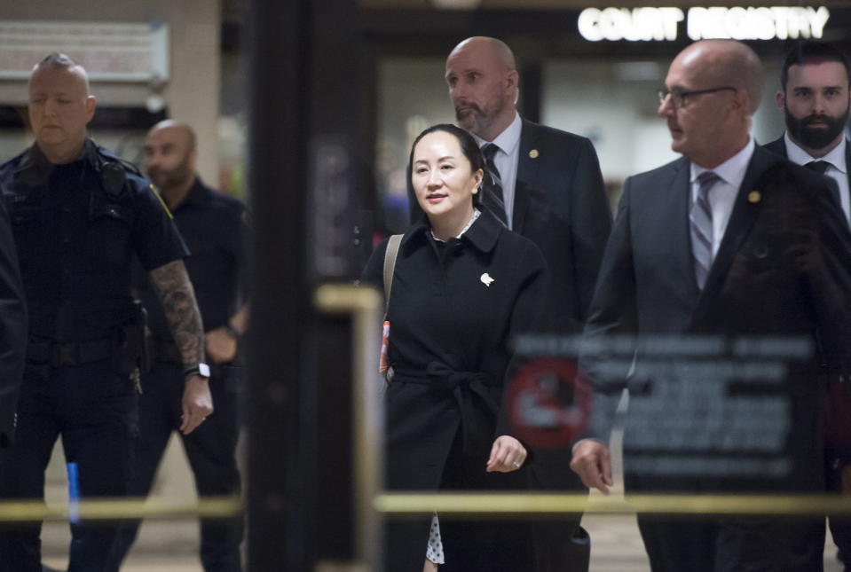 Meng Wanzhou, chief financial officer of Huawei, leaves B.C. Supreme Court in Vancouver, Thursday, January 23, 2020. Wanzhou is in court for hearings over an American request to extradite the executive of the Chinese telecom giant Huawei on fraud charges. (Jonathan Hayward/The Canadian Press via AP)