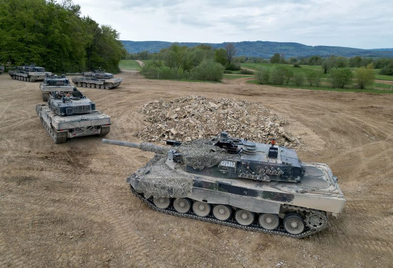 FILE PHOTO: Recruits of the Swiss army Tank School 21 perform an attack exercise with the Leopard 2 tanks in Bure