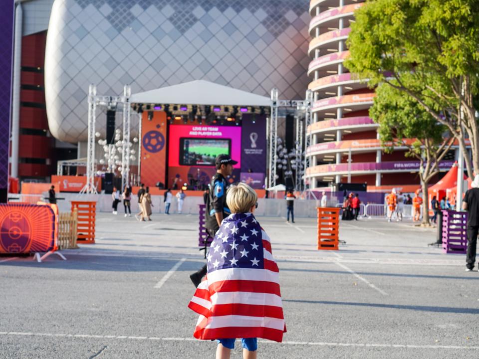 Kathleen Porter Kristiansen's son wearing an American flag as a cape