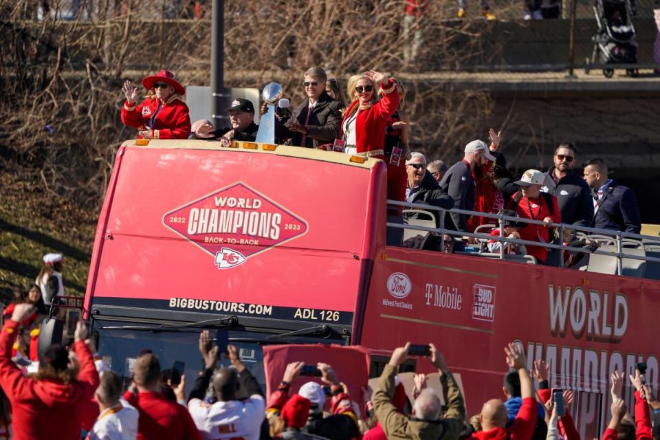 The Kansas City Chiefs head coach Andy Reid and owner Clark Hunt celebrate during the Super Bowl victory parade.<span class="copyright">Ed Zurga—AP</span>