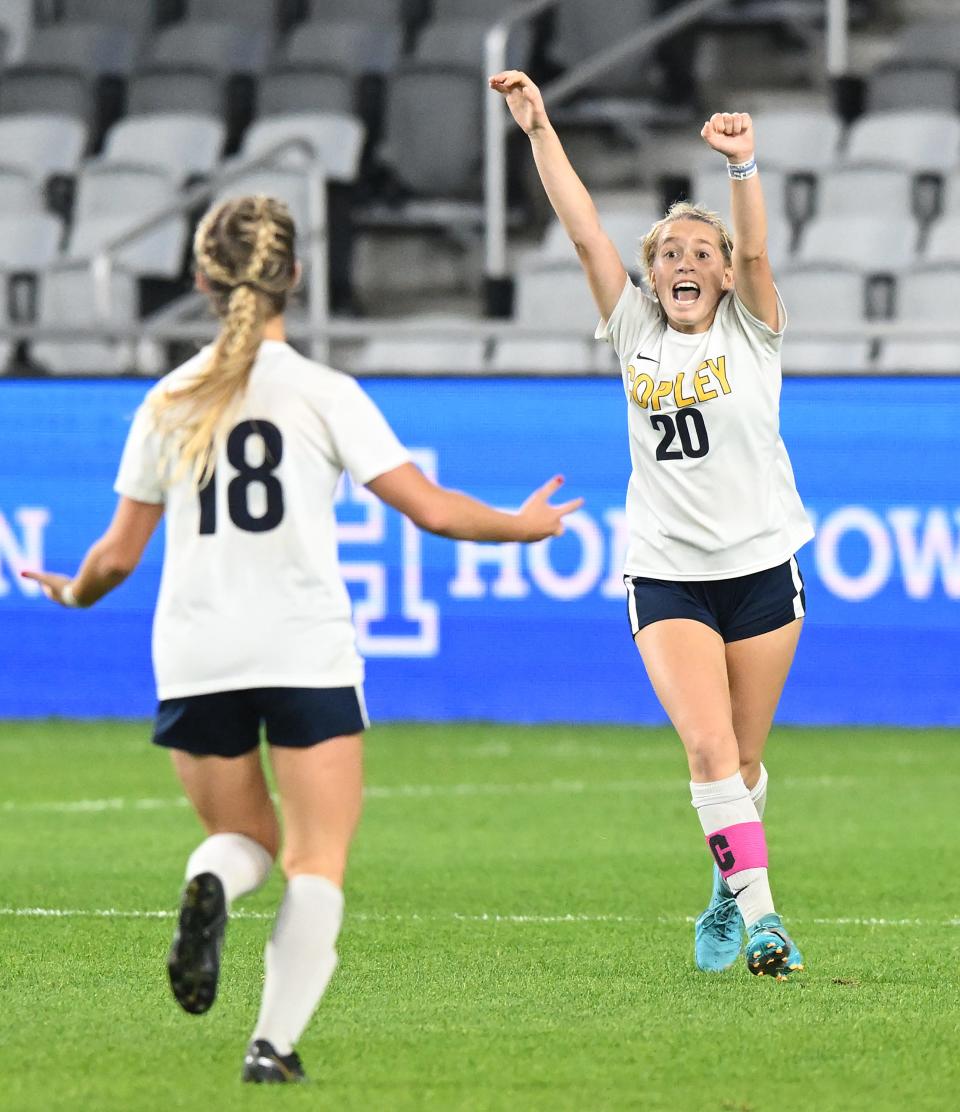 Copley midfielder Allie Arnold, right, celebrates with Emma Niemczura, left, as time expires during the second half of the OHSAA Division II girls state soccer championship game against Waynesville at Lower.com Field, Friday, Nov. 11, 2022, in Columbus, Ohio.