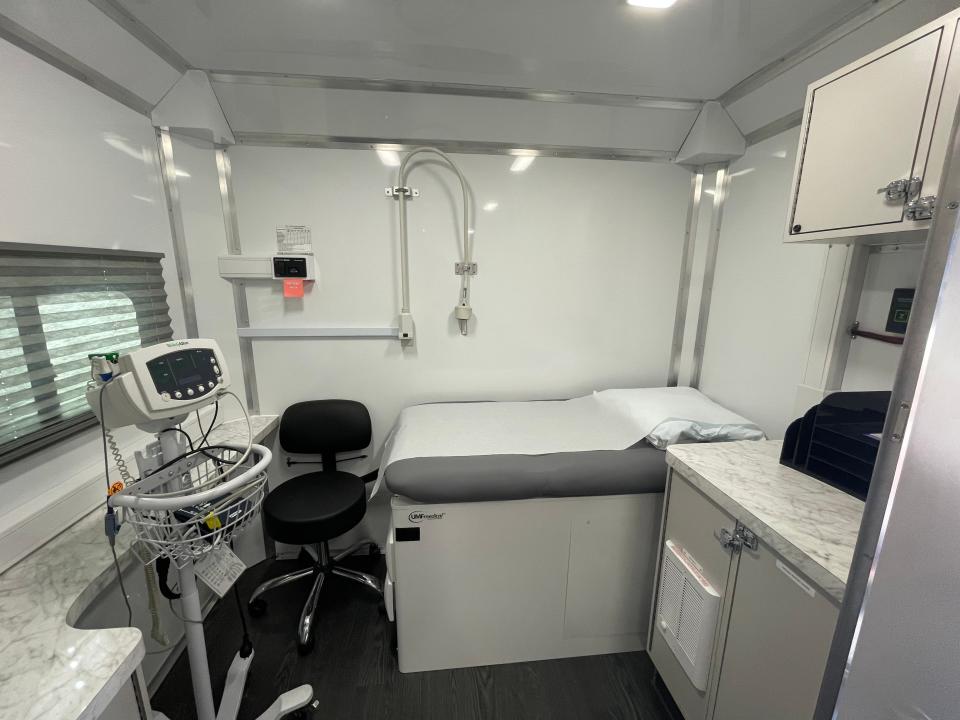 Inside the mobile unit are two exam rooms with beds, a restroom, plenty of cabinets for storage and a refrigerator for medicine and possibly vaccines.