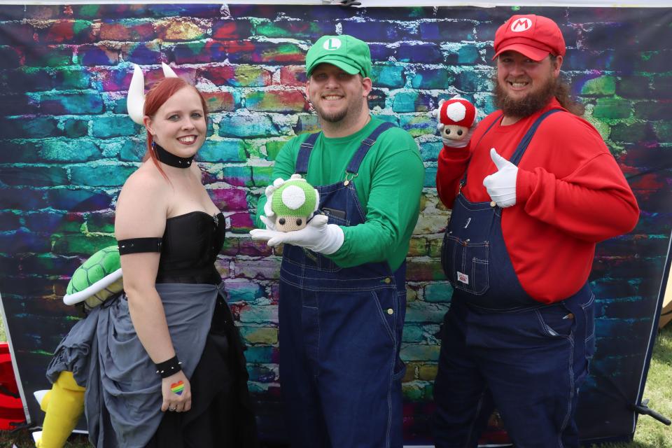 Tosha Magner, Nathan Hicks and Patrick Scager dress as Mario Brother characters for the Amarillo Library's 2021 AMA-Con held outside at the Southwest Amarillo Public Library.