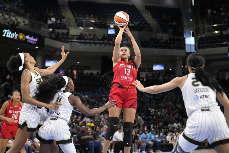 Atlanta Dream's Haley Jones (13) shoots as Chicago Sky defenders watch during the first half of a WNBA basketball game Wednesday, July 10, 2024, in Chicago. (AP Photo/Charles Rex Arbogast)