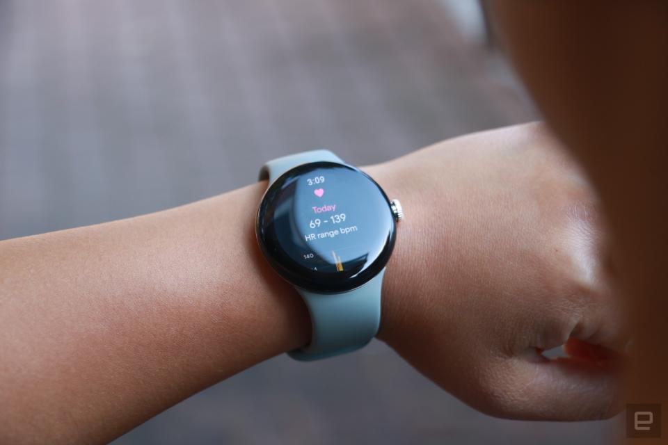 The Pixel Watch on a person's wrist, showing their heart rate range for the day.