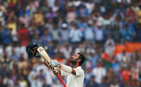 India v Australia - Third Test cricket match - Jharkhand State Cricket Association Stadium, Ranchi, India - 19/03/17 - India's Cheteshwar Pujara celebrates his double century. REUTERS/Adnan Abidi