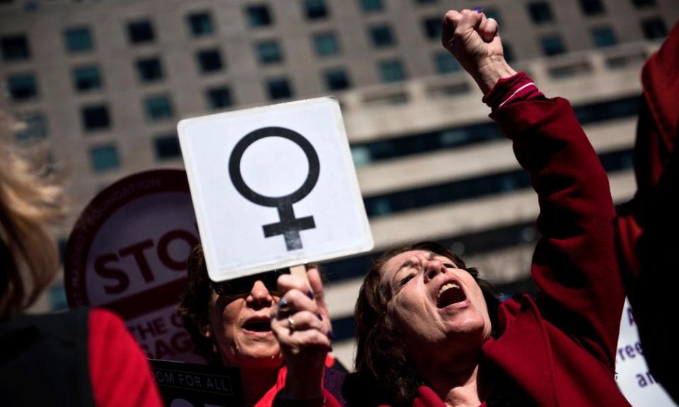 Activists protest against the Trump administration and rally for women’s rights during a march to honor International Woman’s Day on 8 March 2017 in Washington DC.