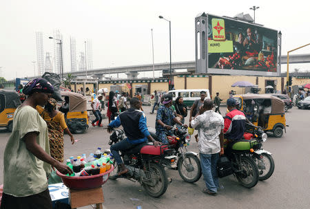 People move on a street ahead of the presidential election, Lagos, Nigeria February 15, 2019. REUTERS/Temilade Adelaja