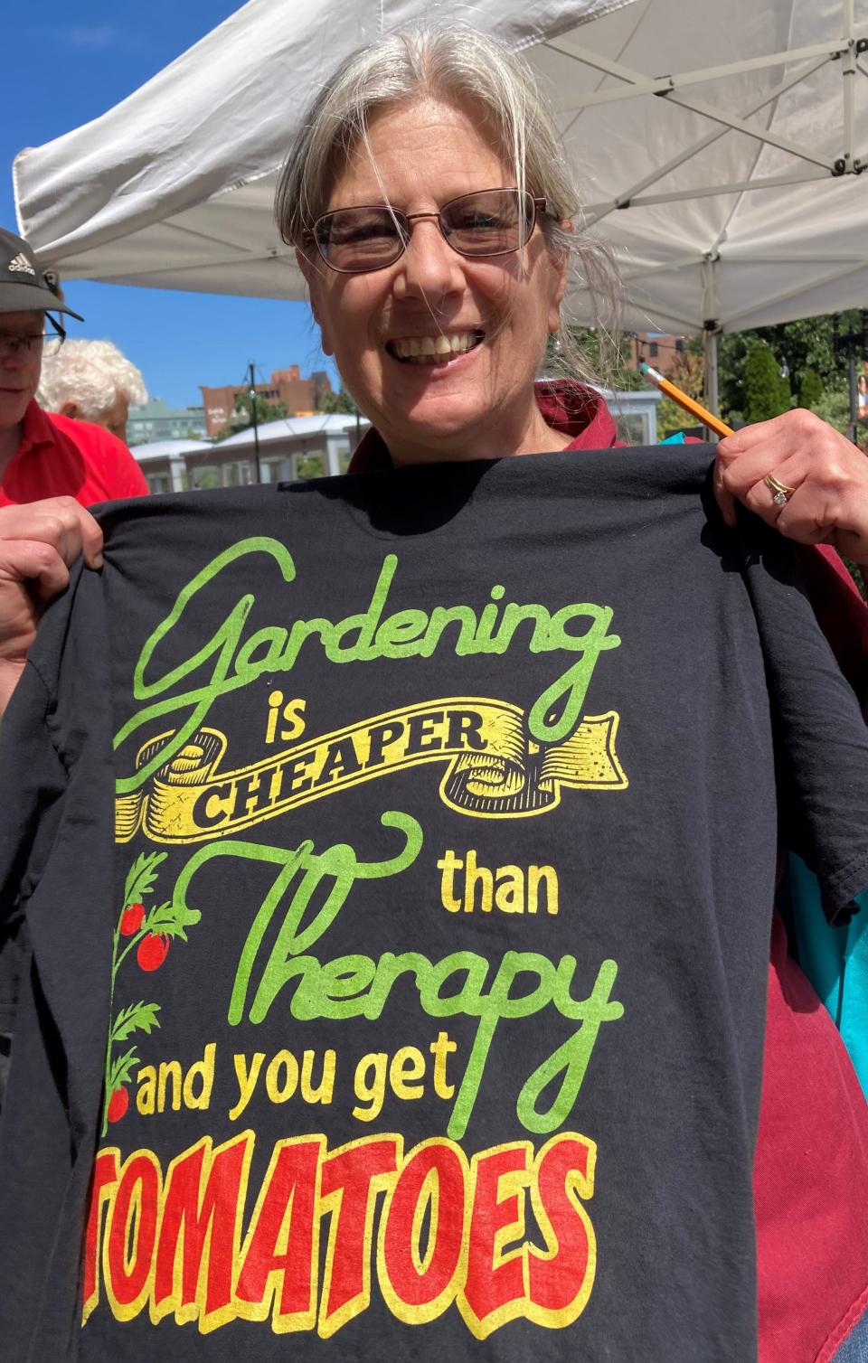 Tina Bemis, who hosts a radio program on WTAG, "Gardener's Calendar," displays one of her favorite shirts at the 38th annual Massachusetts Tomato Contest.