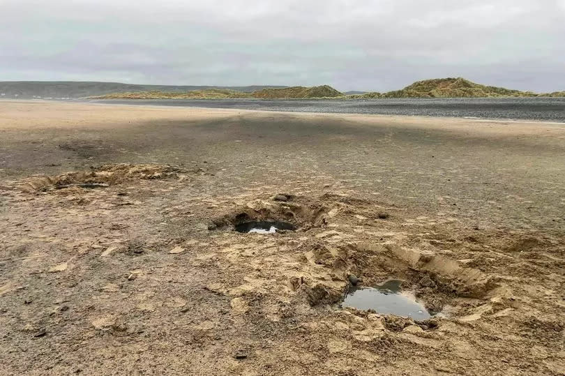 Beach with holes after explosions