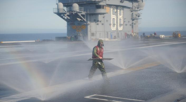 Washing down on the flight deck of the aircraft carrier USS Nimitz