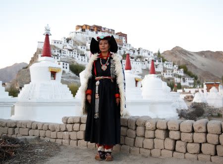 Phunchok Angmo, 33, a mathematics teacher, poses for a photograph at Thiksey monastery, near Leh, the largest town in the region of Ladakh, nestled high in the Indian Himalayas, India September 28, 2016. When asked how living in the worlds fastest growing major economy had affected life, Angmo replied: "The children here no longer care about the culture and they spend less time talking to each other. They spend their free time on laptops." REUTERS/Cathal McNaughton