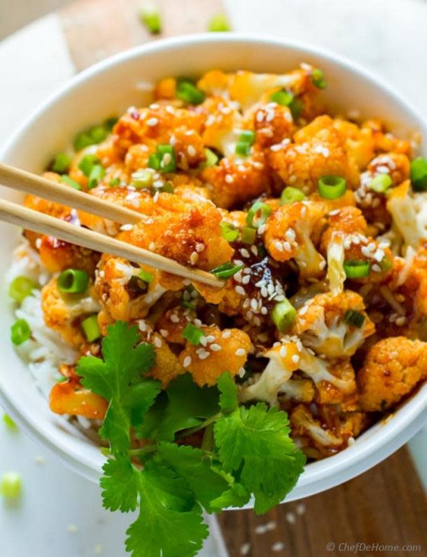 <p>Chef de Home</p><p>Firecracker cauliflower with marinated cauliflower florets, sauteed on high heat to keep it crunchy and then coated in sweet and spicy sauce.</p><p><strong>Get the recipe: <a href="https://www.chefdehome.com/recipes/734/skinny-firecracker-cauliflower-rice-bowl" rel="nofollow noopener" target="_blank" data-ylk="slk:Skinny Firecracker Cauliflower Rice Bowls;elm:context_link;itc:0;sec:content-canvas" class="link rapid-noclick-resp">Skinny Firecracker Cauliflower Rice Bowls</a></strong></p>