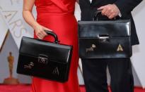 Oscar winning ballots are carried along the red carpet by personnel from Price Waterhouse Coopers as they arrive for the 89th Academy Awards in Hollywood, California, U.S. February 26, 2017. REUTERS/Mike Blake