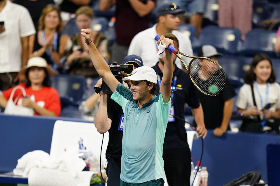 Brandon Holt, of the United States, reacts after defeating Taylor Fritz, of the United States, during the first round of the US Open tennis championships, Monday, Aug. 29, 2022, in New York. (AP Photo/Frank Franklin II)