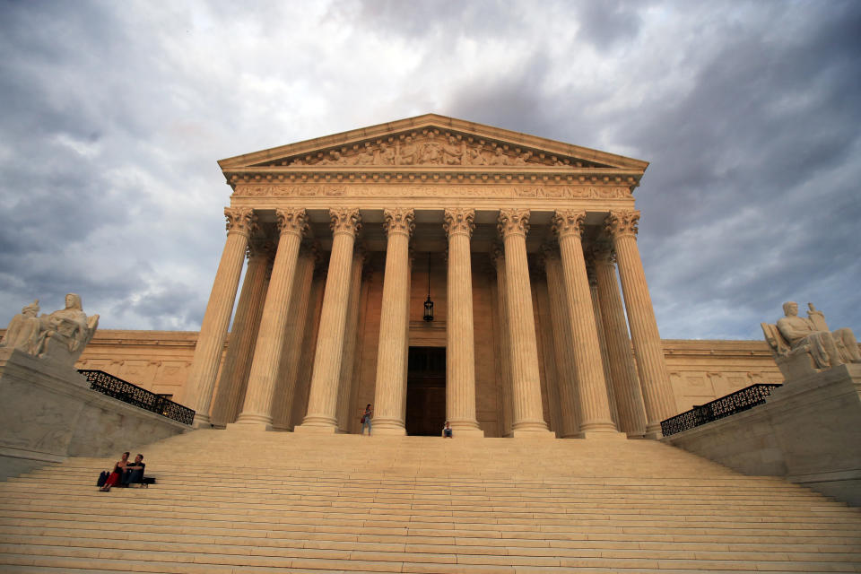 FILE - The U.S. Supreme Court is seen at near sunset in Washington, on Oct. 18, 2018. Democrats on the Senate Judiciary Committee voted Thursday to authorize subpoenas for two prominent conservatives who arranged luxury travel and other benefits for Supreme Court justices, but Republicans planned to object to the legitimacy of the action. The panel’s Democratic chairman, Illinois Sen. Dick Durbin, pushed through the vote in the meeting's final moments Thursday after Republicans walked out of the meeting. (AP Photo/Manuel Balce Ceneta, File)