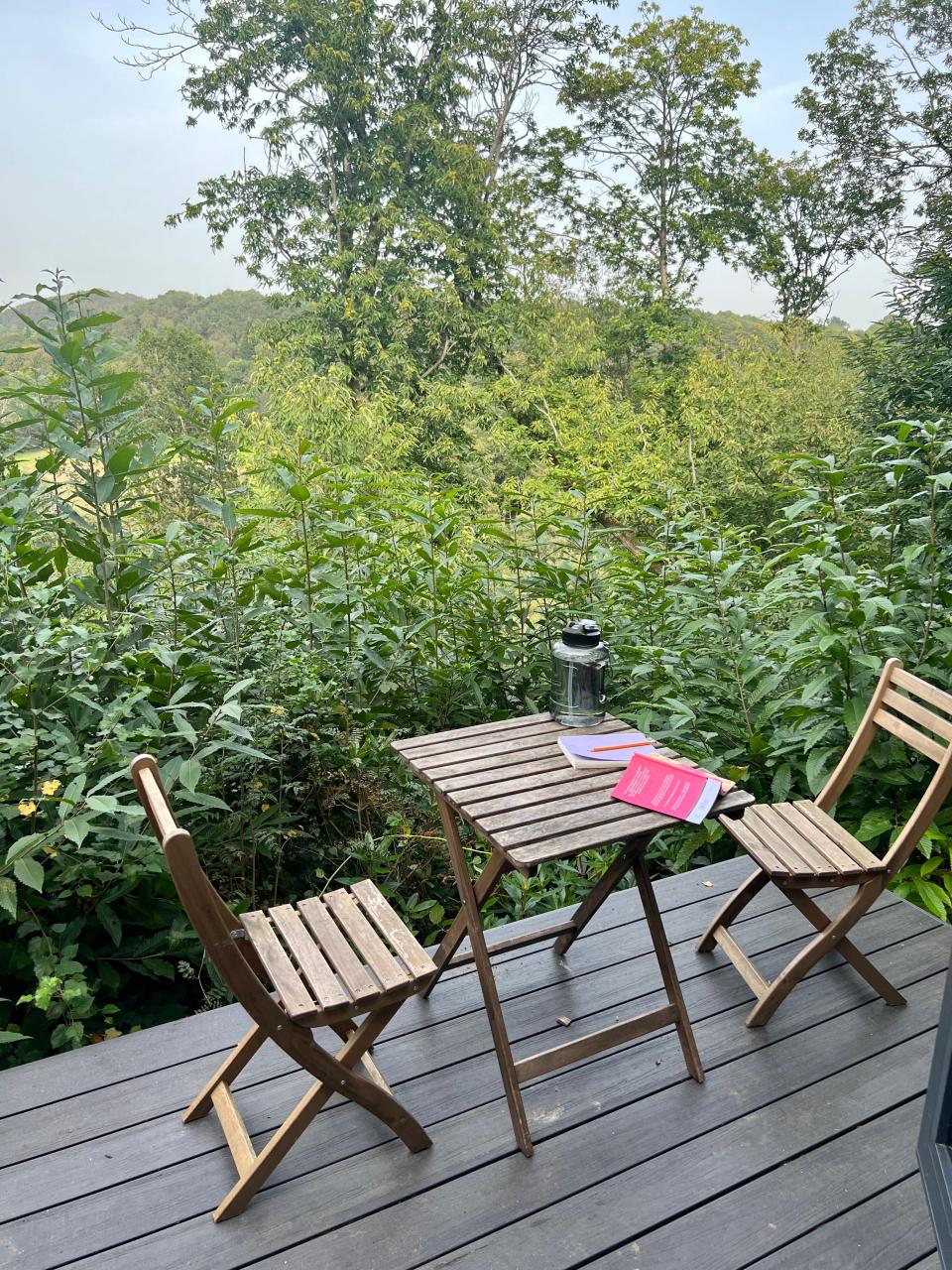 The porch came with a small wooden table and two chairs.