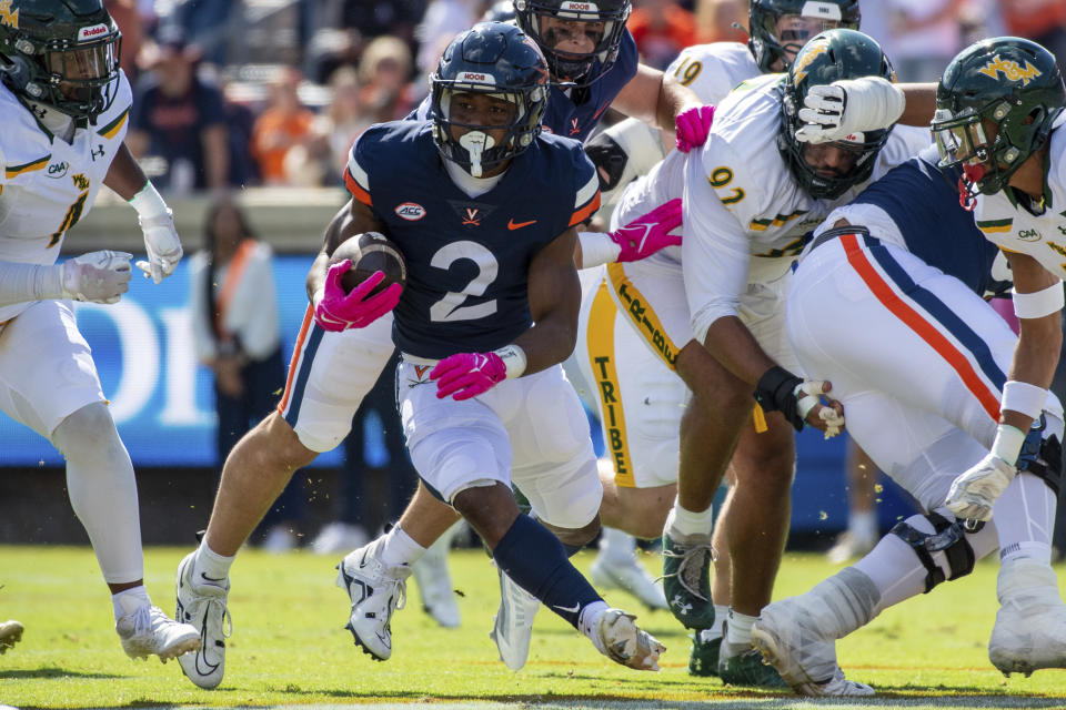 Virginia running back Perris Jones (2) runs for a gain against William & Mary during the first half of an NCAA college football game Saturday, Oct. 7, 2023, in Charlottesville, Va. (AP Photo/Mike Caudill)