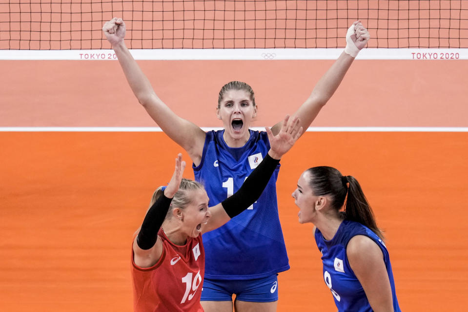 Russian Olympic Committee team players celebrate their victory over China during a women's volleyball preliminary round pool B match between China and Russian Olympic Committee at the 2020 Summer Olympics, Thursday, July 29, 2021, in Tokyo, Japan. (AP Photo/Manu Fernandez)