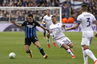 Brugge's Hugo Vetlesen, left, fights for the ball with Fiorentina's Lucas Beltran, center, during the Europa Conference League semi-final second leg soccer match between Club Brugge and Fiorentina at the Jan Breydel Stadium in Bruges, Belgium, Wednesday, May 8, 2024. (AP Photo/Omar Havana)