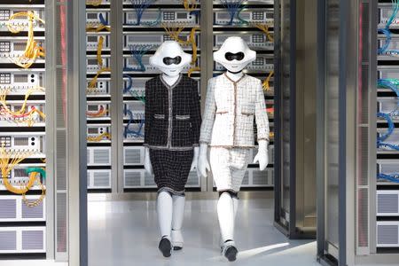 Models present creations by German designer Karl Lagerfeld as part of his Spring/Summer 2017 women's ready-to-wear collection for fashion house Chanel. REUTERS/Charles Platiau