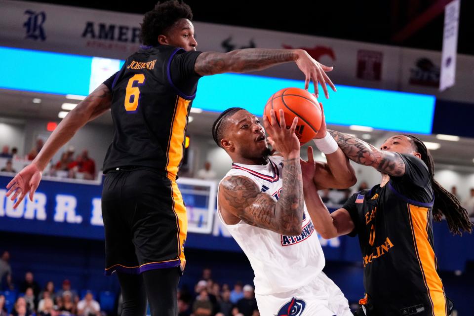 Jan 2, 2024; Boca Raton, Florida, USA; Florida Atlantic Owls guard Alijah Martin (15) shoots against East Carolina Pirates forward Brandon Johnson (6) during the second half at Eleanor R. Baldwin Arena. Mandatory Credit: Rich Storry-USA TODAY Sports