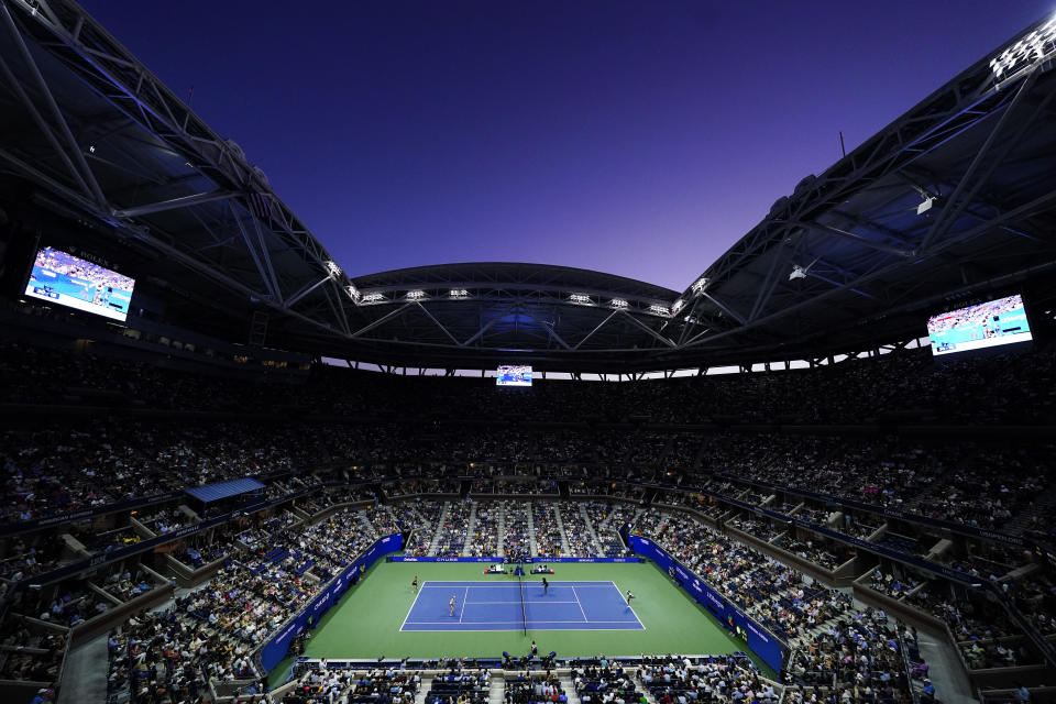 Venus Williams, right, and Serena Williams, of the United States, play their first-round doubles match against Lucie Hradecká right, and Linda Nosková, of the Czech Republic, at the U.S. Open tennis championships, Thursday, Sept. 1, 2022, in New York. (AP Photo/Frank Franklin II)