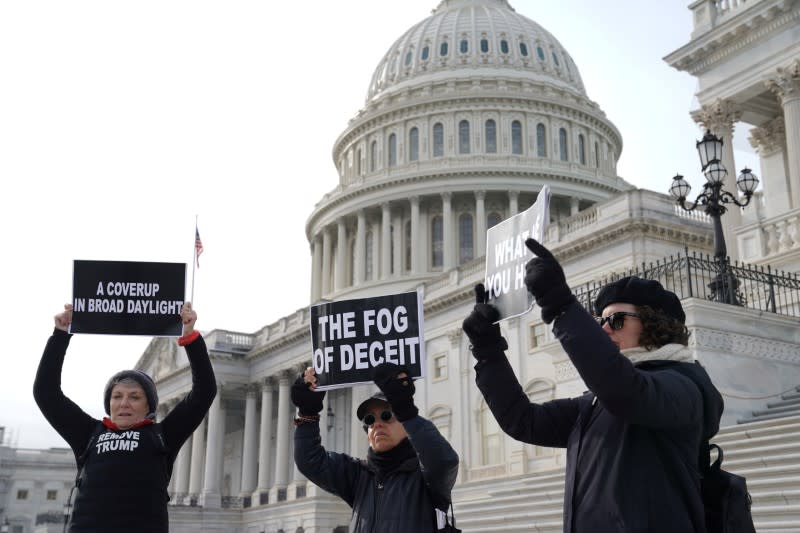 Demonstrators gather on Capitol Hill on day three of the impeachment trial of President Trump in Washington