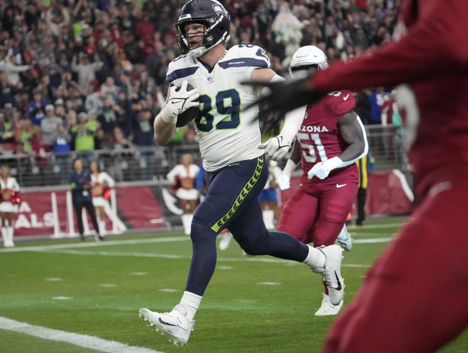 Seattle Seahawks tight end Will Dissly (89) scores after a catch against the Arizona Cardinals during the second quarter at State Farm Stadium in Glendale on Jan. 7, 2024.