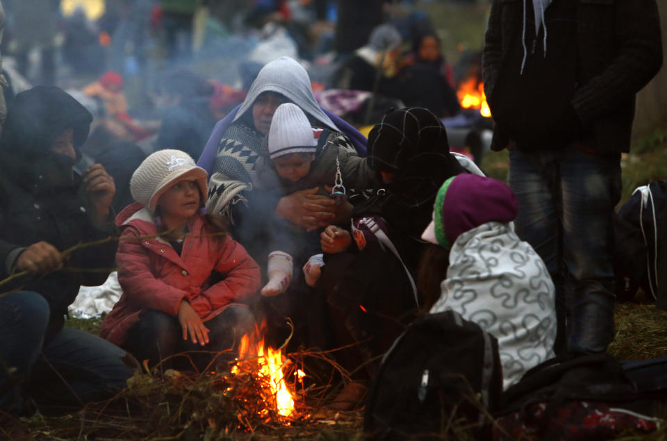 Families fleeing violence in Syria, here huddled around a fire at&nbsp;a makeshift camp in Slovenia in 2015, are easy prey for extremists who promise food, shelter and adventure. (Photo: Srdjan Zivulovic/Reuters)