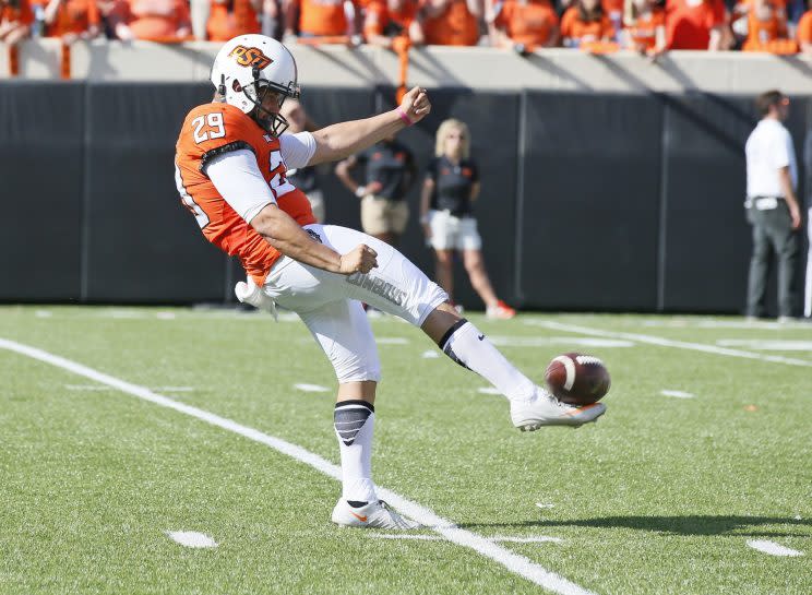 A punter connecting with the ball is way better than the Heisman pose anyway. (AP Photo/Sue Ogrocki)