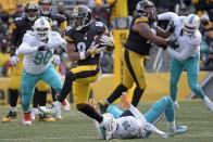<p>Pittsburgh Steelers wide receiver Antonio Brown (84) gets past Miami Dolphins free safety Bacarri Rambo (30) en route to the end zone for his second touchdown during the first half of an AFC Wild Card NFL football game in Pittsburgh, Sunday, Jan. 8, 2017. (AP Photo/Fred Vuich) </p>