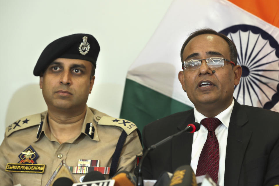 Government spokesperson Rohit Kansal, right, speaks as Swayam Prakash Pani, left, Inspector General of Police of Kashmir Range during a press conference, sits beside him in Srinagar, Indian controlled Kashmir, Saturday, Oct. 12 2019. The Indian government on Saturday announced that all post paid mobile phone will be restored on Oct. 14, 70 days after a communication blockade was put in place in disputed Kashmir. (AP Photo/Dar Yasin)