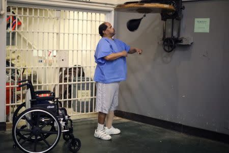 Andrew Rachal, 58, punches a speed bag in the gym at the California Medical Facility prison in Vacaville, California, U.S., May 23, 2018. REUTERS/Lucy Nicholson