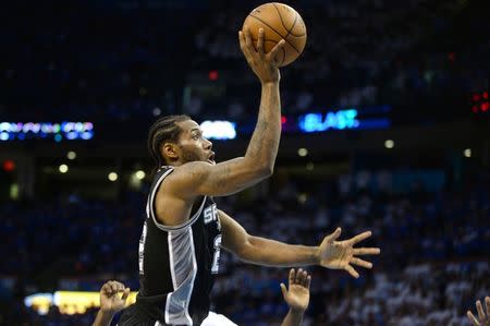 May 6, 2016; Oklahoma City, OK, USA; San Antonio Spurs forward Kawhi Leonard (2) shoots the ball against the Oklahoma City Thunder during the fourth quarter in game three of the second round of the NBA Playoffs at Chesapeake Energy Arena. Mandatory Credit: Mark D. Smith-USA TODAY Sports