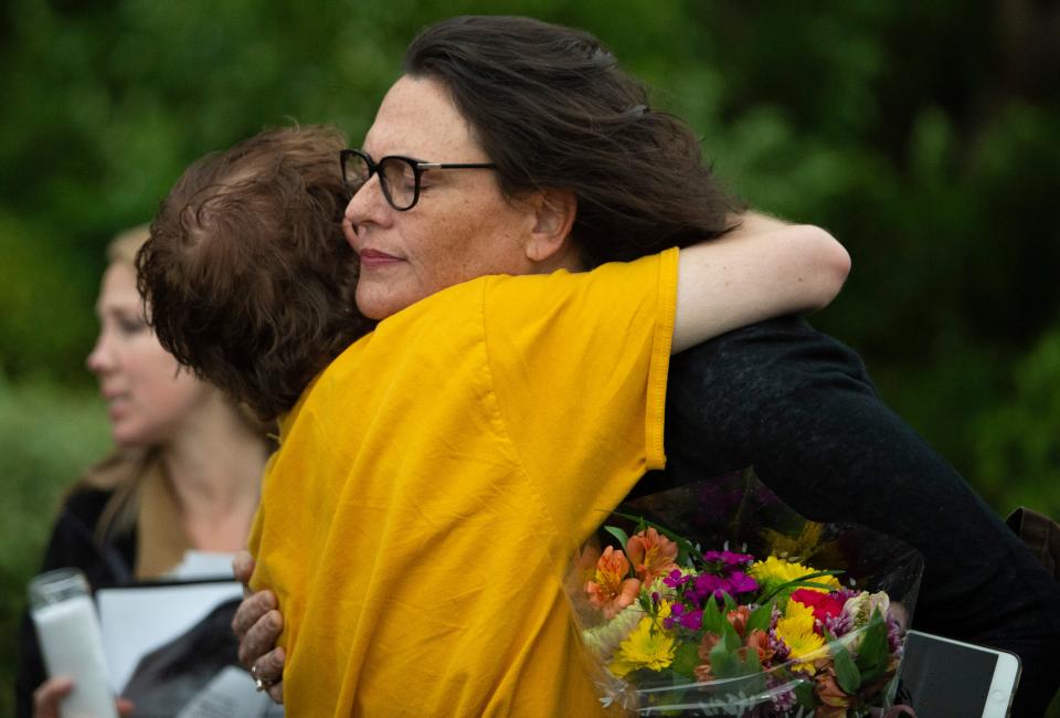 Tyler Bull hugs Karen Griffin during a vigil to honor her son Jacob Griffin Thursday, May 6, 2021 in Brentwood, Tenn.  Jacob Griffin, who suffered from schizophrenia, died after a long and tense standoff with the Nashville police department's SWAT team. Police spokesman Don Aaron said an officer shot the 23-year-old after Griffin fired his gun twice.