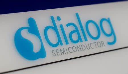 FILE PHOTO: Dialog semiconductor logo is pictured at a company building in Germering near Munich, Germany August 15, 2016. REUTERS/Michaela Rehle