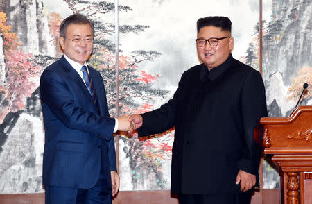 South Korean President Moon Jae-in shakes hands with North Korean leader Kim Jong Un after a joint press conference in Pyongyang, North Korea, September 19, 2018. Pyeongyang Press Corps/Pool via REUTERS